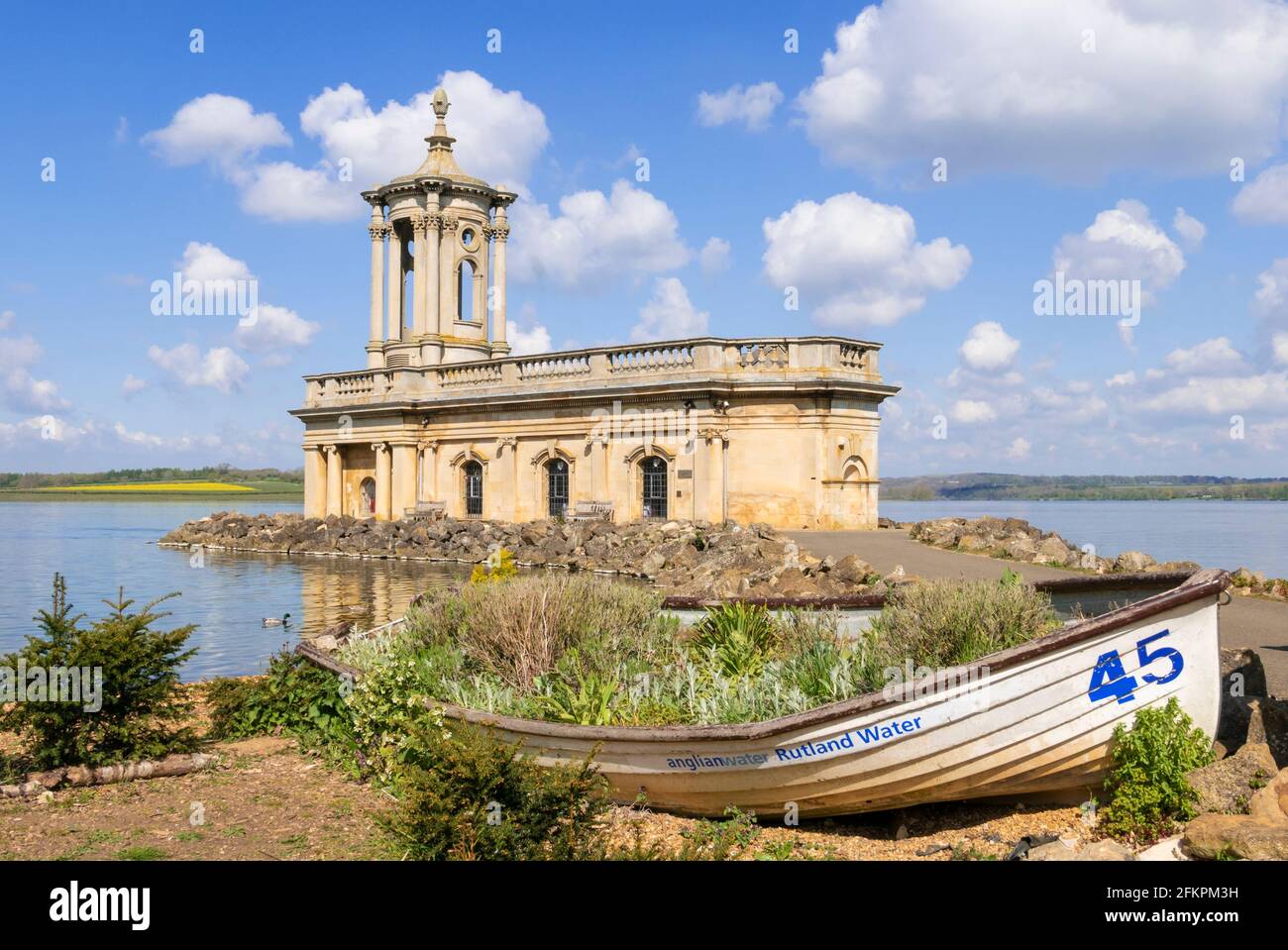 Rutland water church with small boat, Normanton Church at Rutland Water ...
