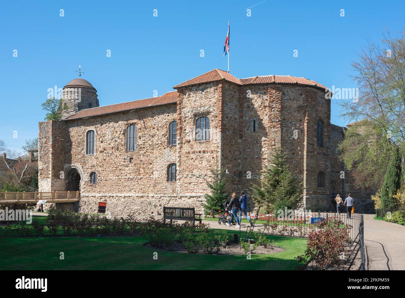 Colchester Castle, view in summer of people in the Castle Park looking at the castle, parts of which date from 1st Century AD, Colchester Essex, UK Stock Photo