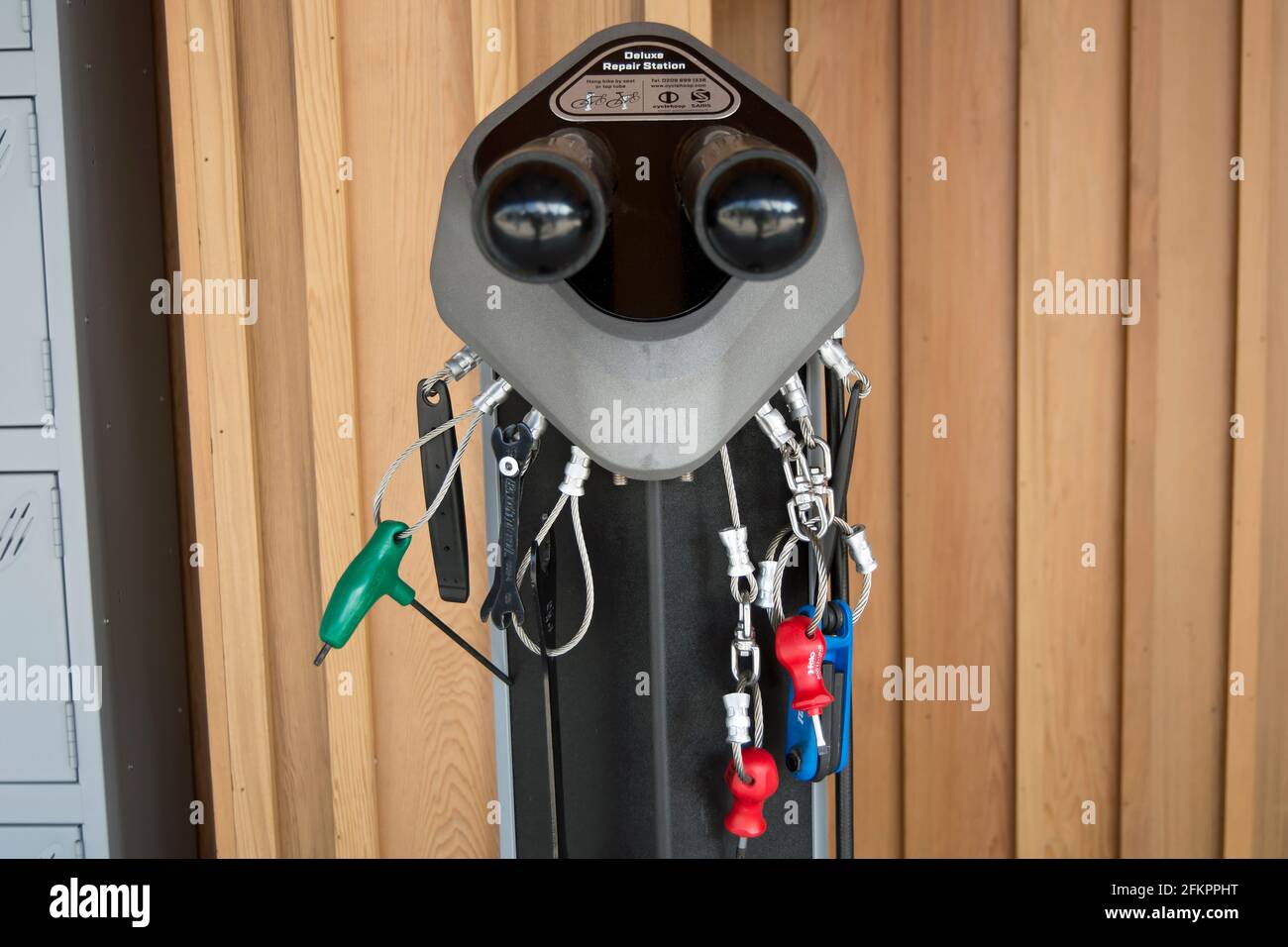 bike repair stand, or repair station, with attached tools at the cycle hub of kingston railway station, surrey, england Stock Photo