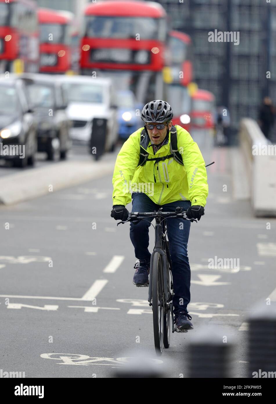 London, England, UK. Cyclist on Westminster Bridge, in the cycle lane Stock Photo