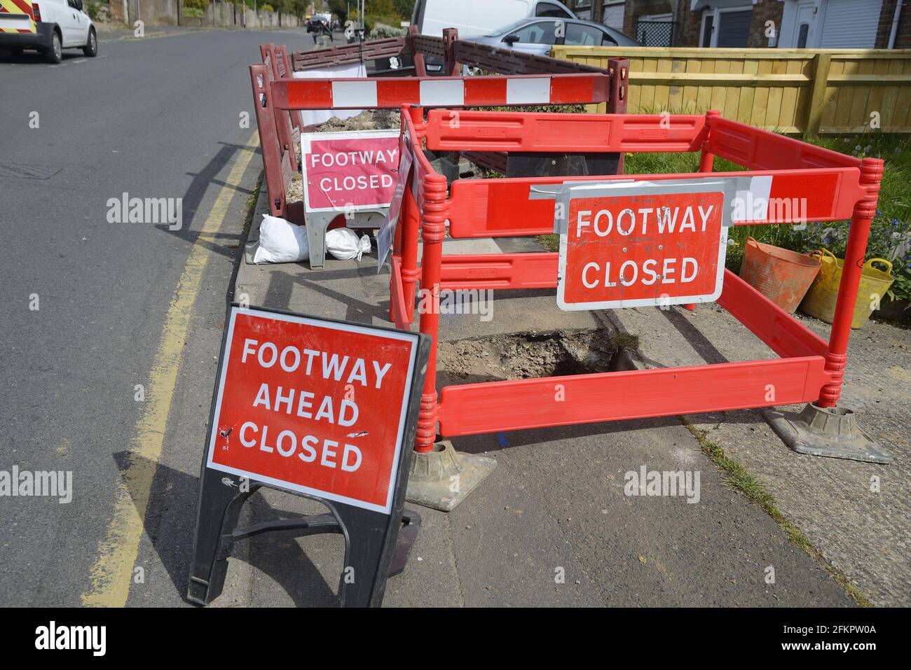 Maidstone, Kent, UK. Footway Closed signs at a caved-in pavement Stock Photo