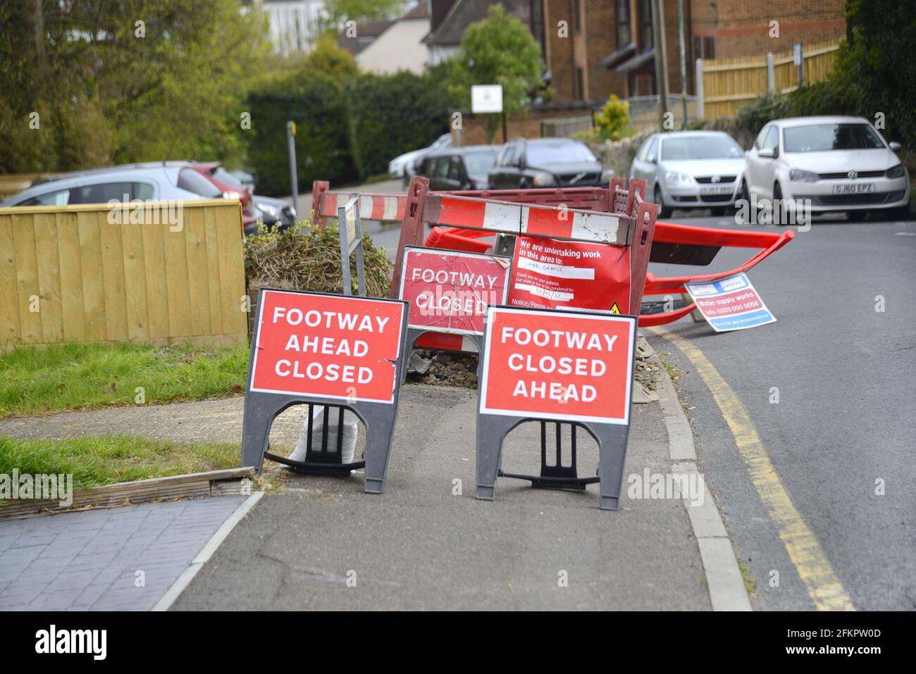 Maidstone, Kent, UK. 3 different Footpath Closed signs at a caved-in pavement Stock Photo