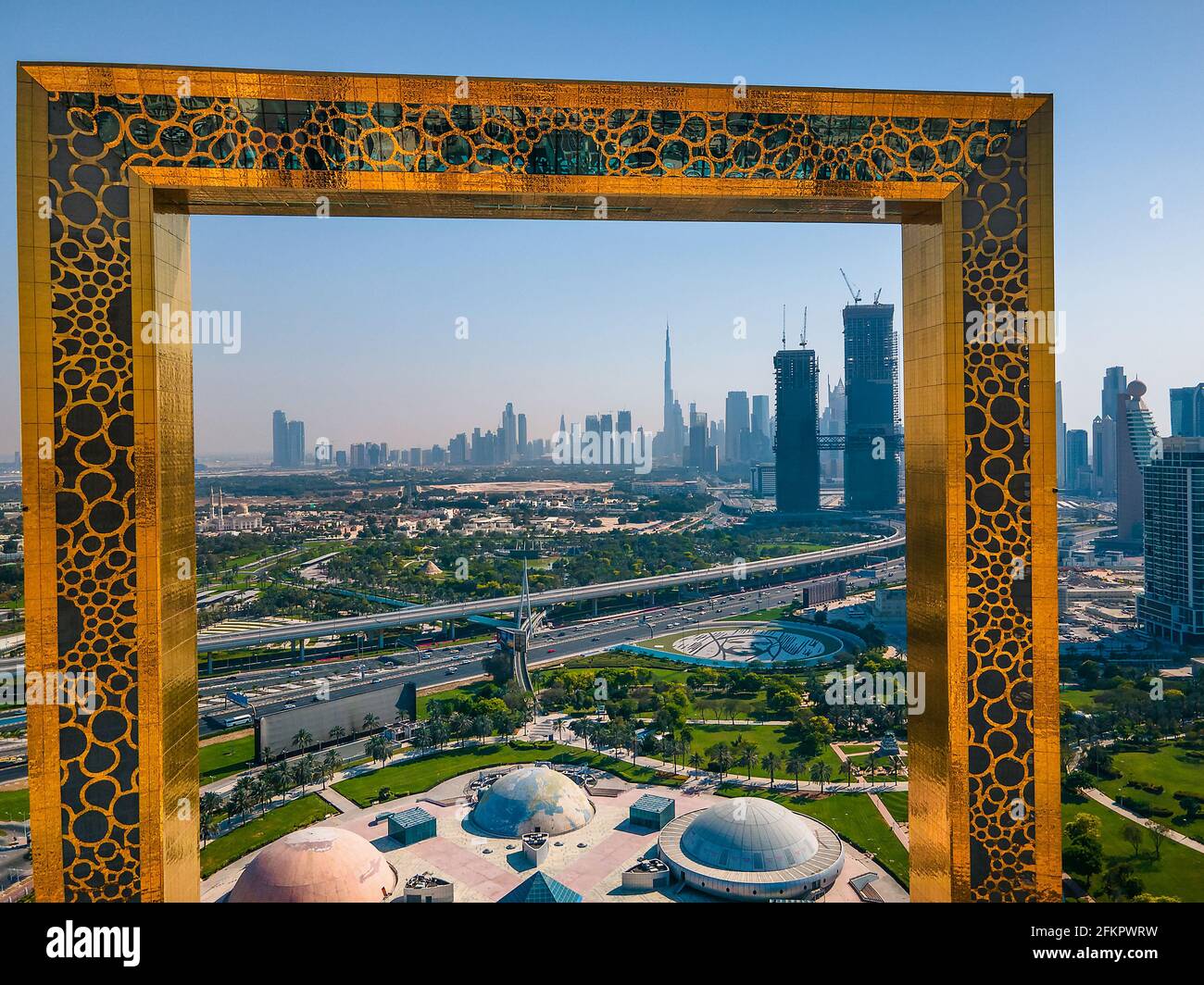 Dubai, United Arab Emirates, April 19, 2021: Dubai skyline seen through Dubai Frame building with Zabeel park and Dubai skyline aerial cityscape view Stock Photo