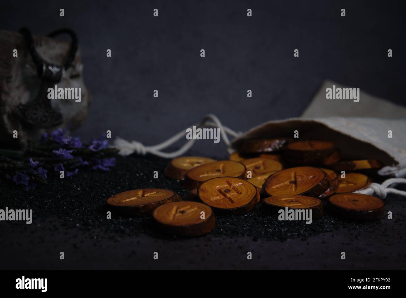 homemade wooden runes on a dark background Stock Photo - Alamy