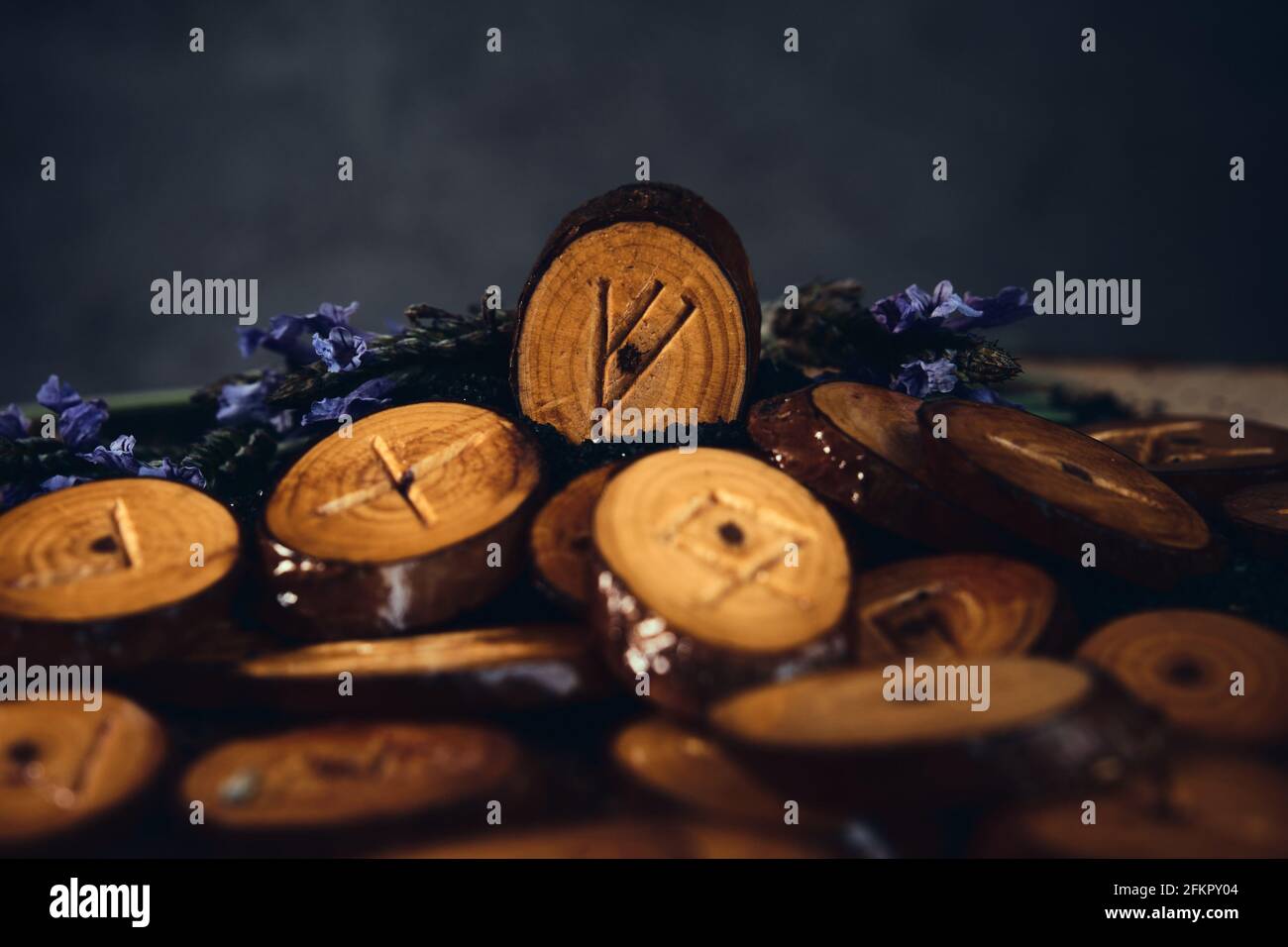 homemade wooden runes on a dark background Stock Photo - Alamy