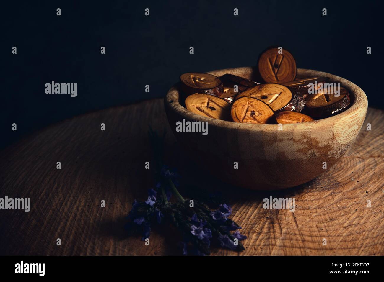 homemade wooden runes on a dark background Stock Photo - Alamy