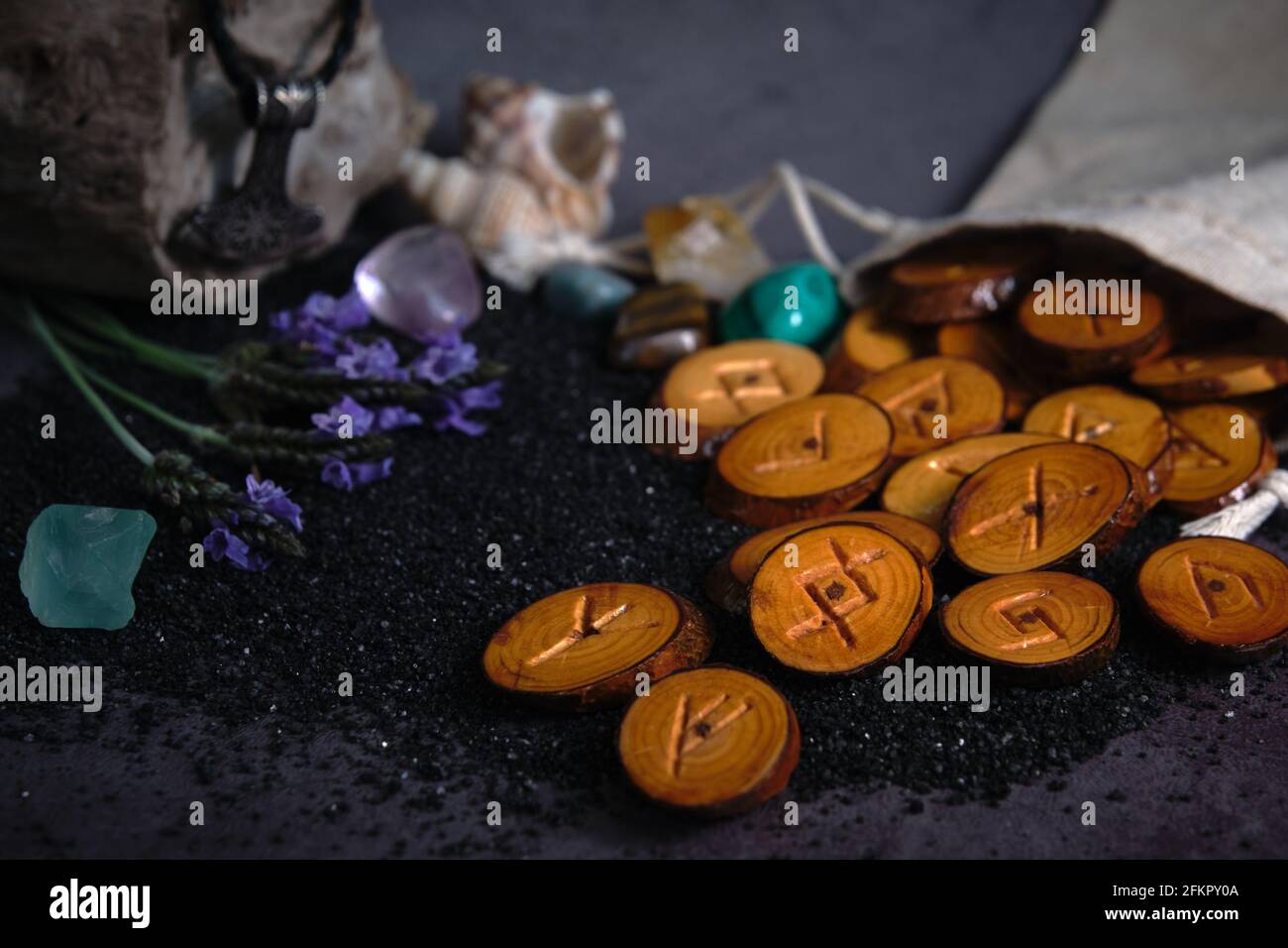 homemade wooden runes on a dark background Stock Photo - Alamy