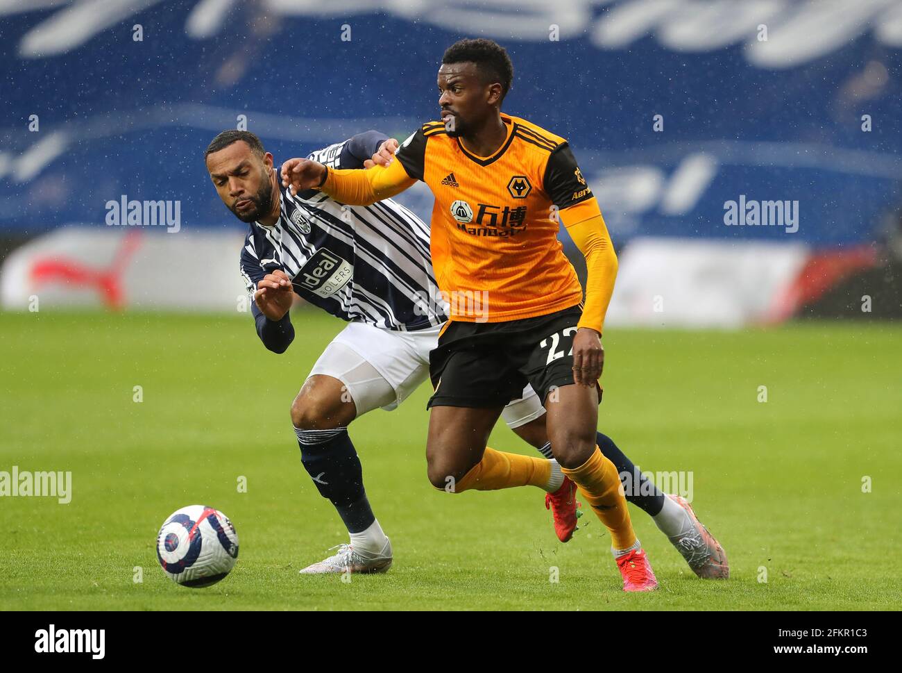 West Bromwich Albion's Matt Phillips (left) and Wolverhampton Wanderers' Nelson Semedo battle for the ball during the Premier League match at The Hawthorns, West Bromwich. Issue date: Monday May 3, 2021. Stock Photo
