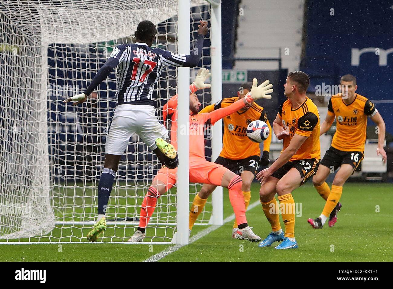 West Bromwich Albion's Mbaye Diagne sees his shot saved by Wolverhampton Wanderers goalkeeper Rui Patricio during the Premier League match at The Hawthorns, West Bromwich. Issue date: Monday May 3, 2021. Stock Photo