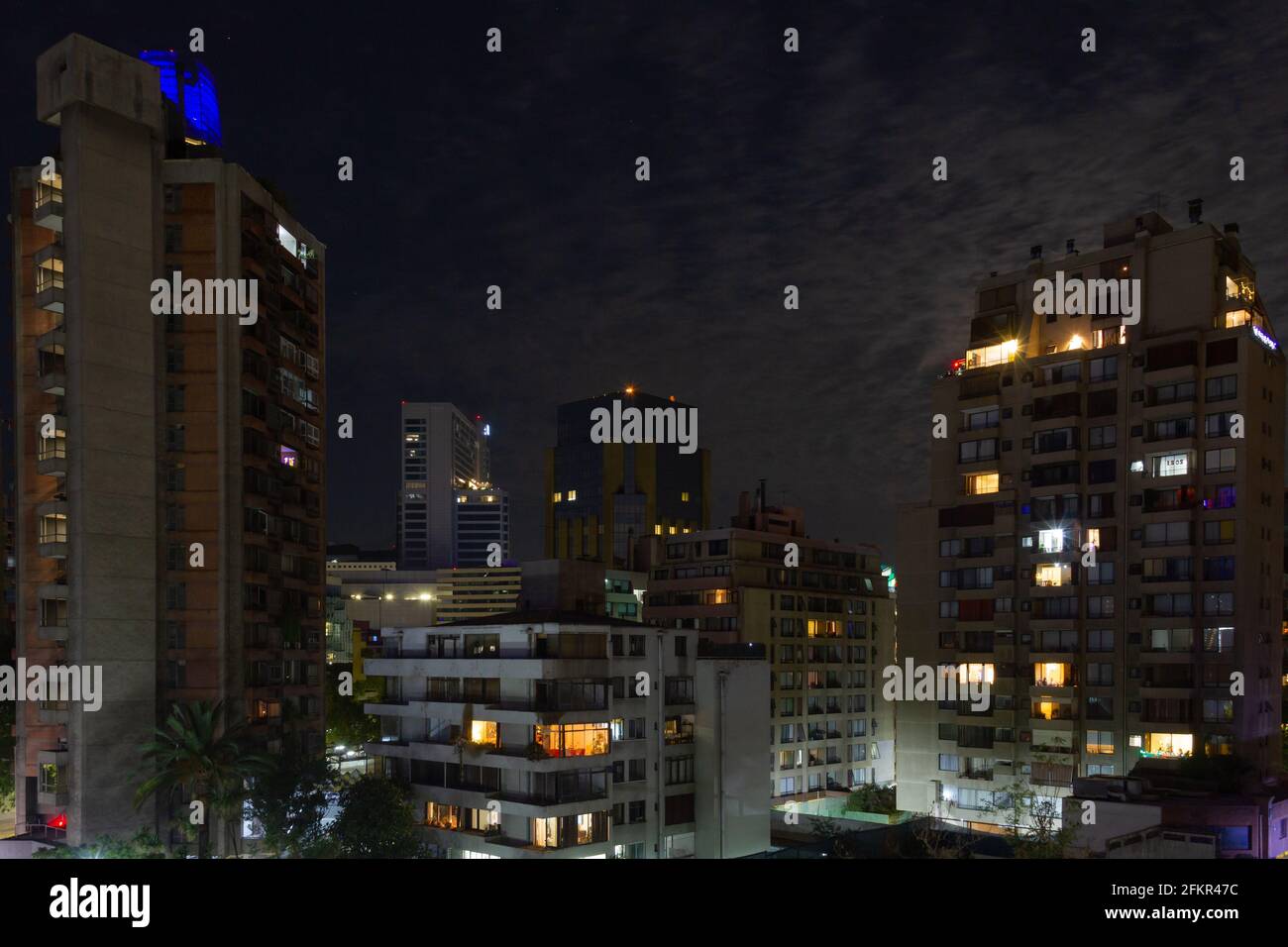 Tall apartment buildings at night. Residential neighborhood in Santiago