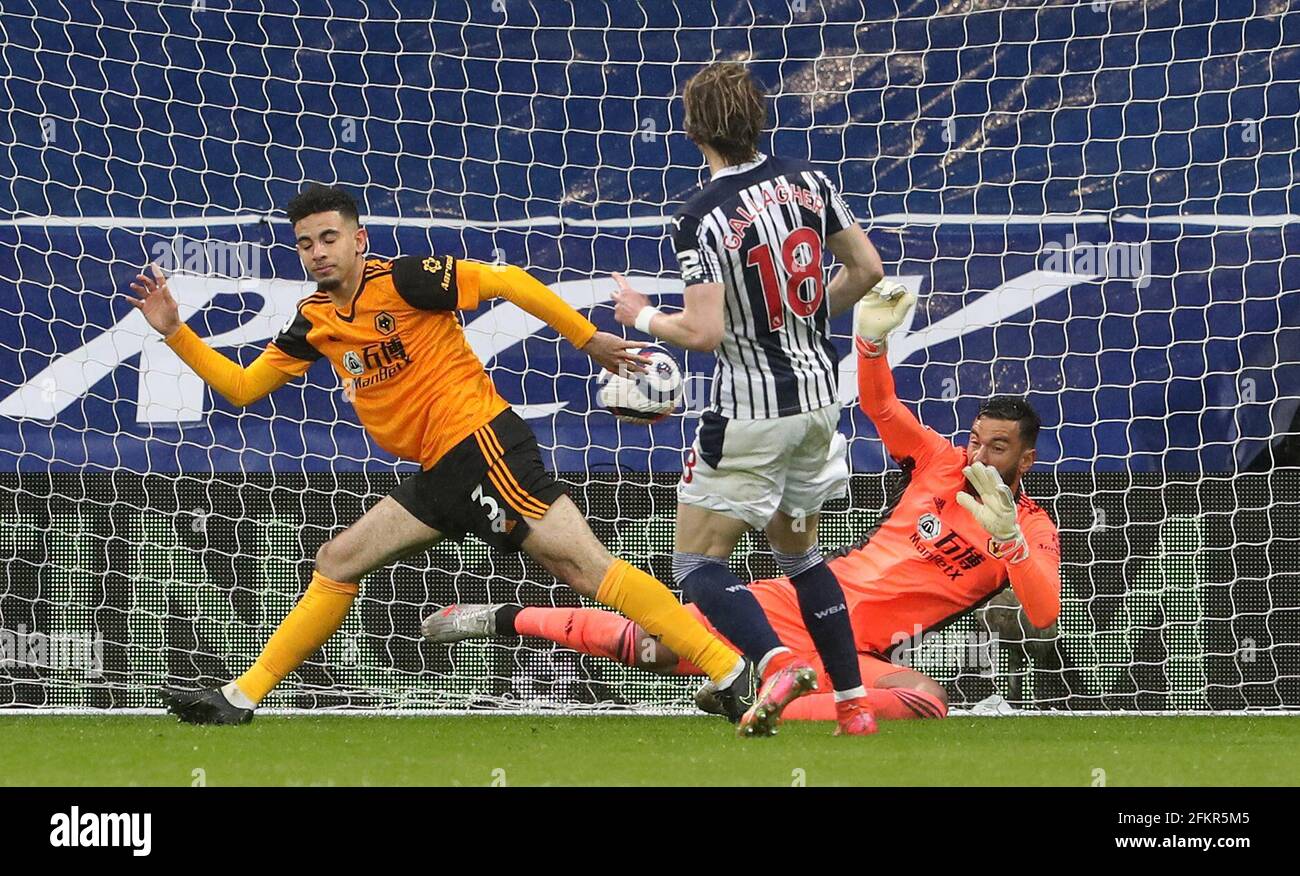 West Bromwich Albion's Conor Gallagher sees his shot saved by Wolverhampton Wanderers goalkeeper Rui Patricio (right) during the Premier League match at The Hawthorns, West Bromwich. Issue date: Monday May 3, 2021. Stock Photo