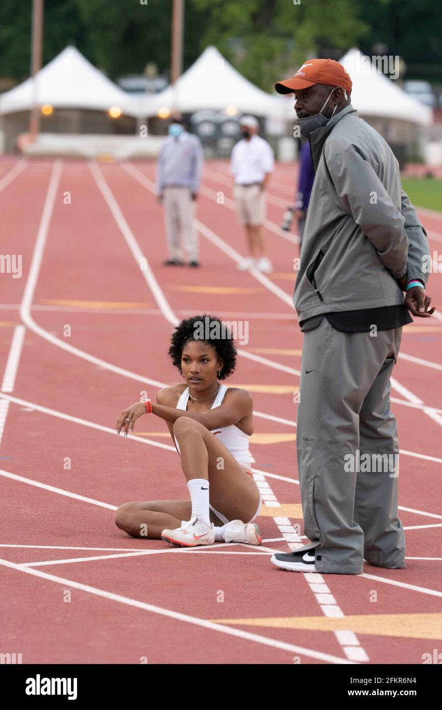 Austin, Texas, USA. 01st May, 2021. Texas women's long jump ace Tara Davis talks with coach Edrick Floreal after soaring to an easy victory at the Texas Invitational as she continues a quest for a spot on the 2021 U.S. Olympic team. Credit: Bob Daemmrich/Alamy Live News Credit: Bob Daemmrich/Alamy Live News Stock Photo