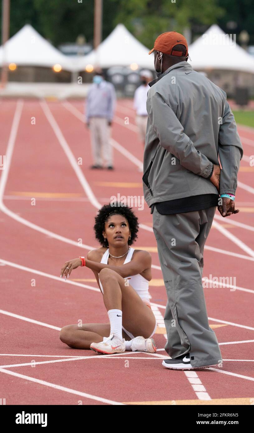 Austin, Texas, USA. 01st May, 2021. Texas women's long jump ace Tara Davis talks with coach Edrick Floreal after soaring to an easy victory at the Texas Invitational as she continues a quest for a spot on the 2021 U.S. Olympic team. Credit: Bob Daemmrich/Alamy Live News Credit: Bob Daemmrich/Alamy Live News Stock Photo