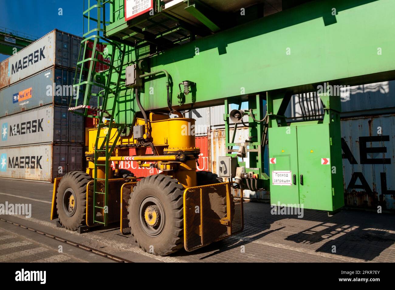 Container loader heavy machine with huge tires. TIS container terminal ...