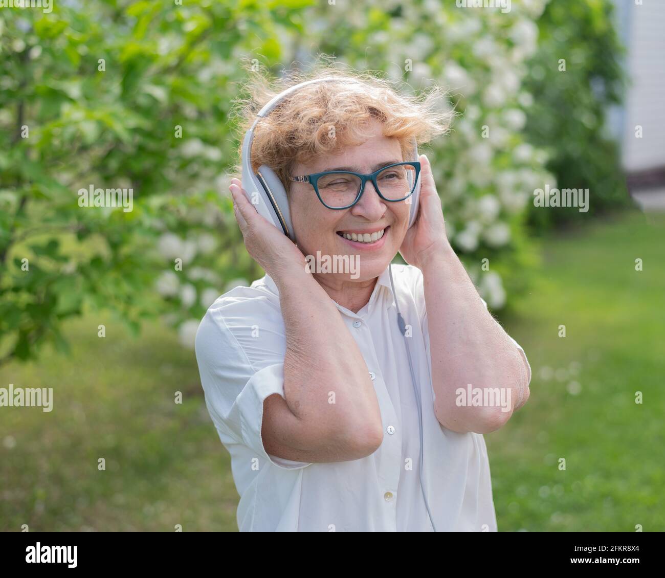 Happy smiling old woman walks hi-res stock photography and images - Alamy