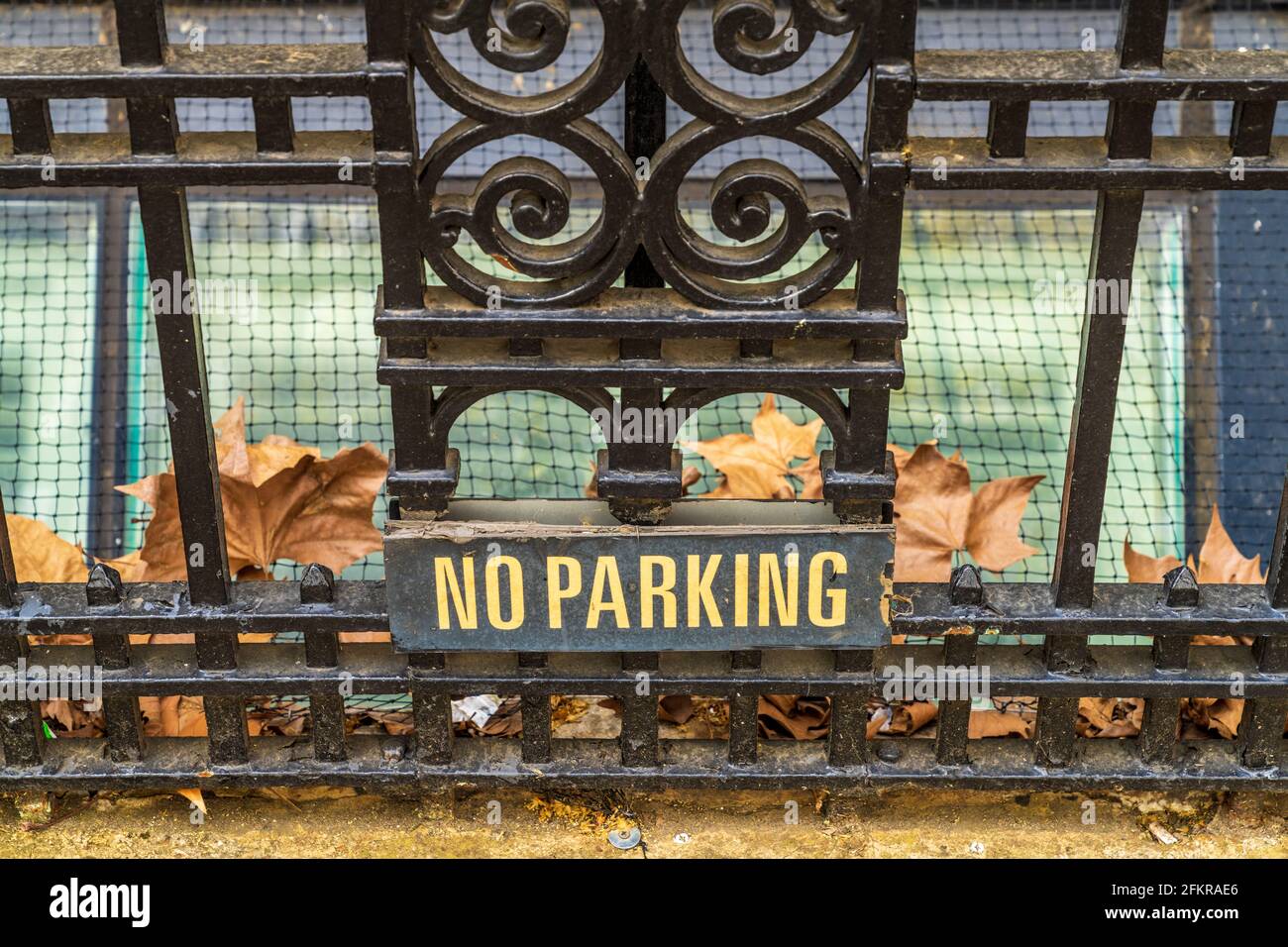No Parking Sign London - discreet No Parking sign on railings in front of a house in Charterhouse Square London. Low key No Parking Sign. Stock Photo