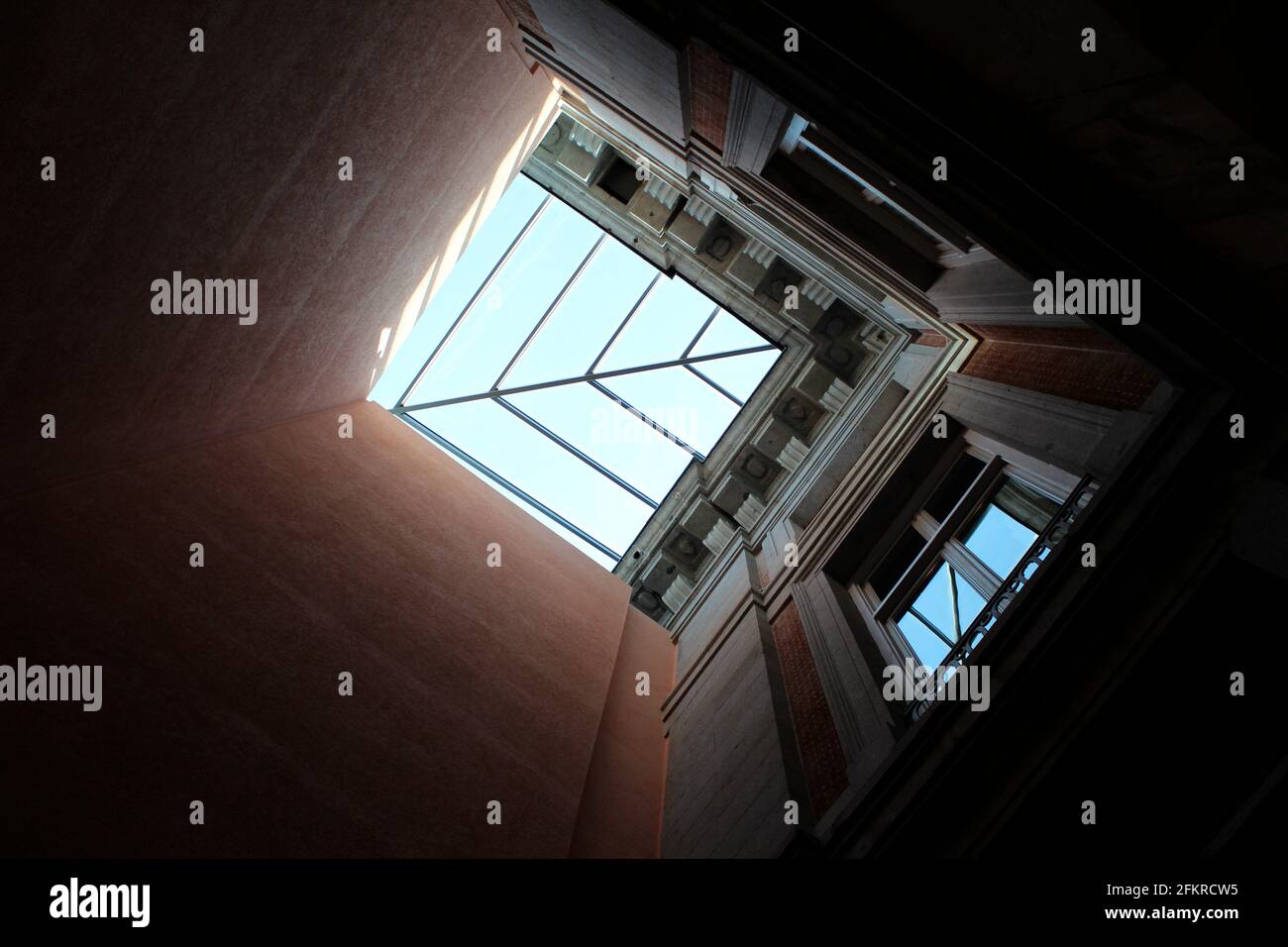 View looking up at skylight in brick facades and classical architecture, Prado Museum, Madrid, Spain Stock Photo