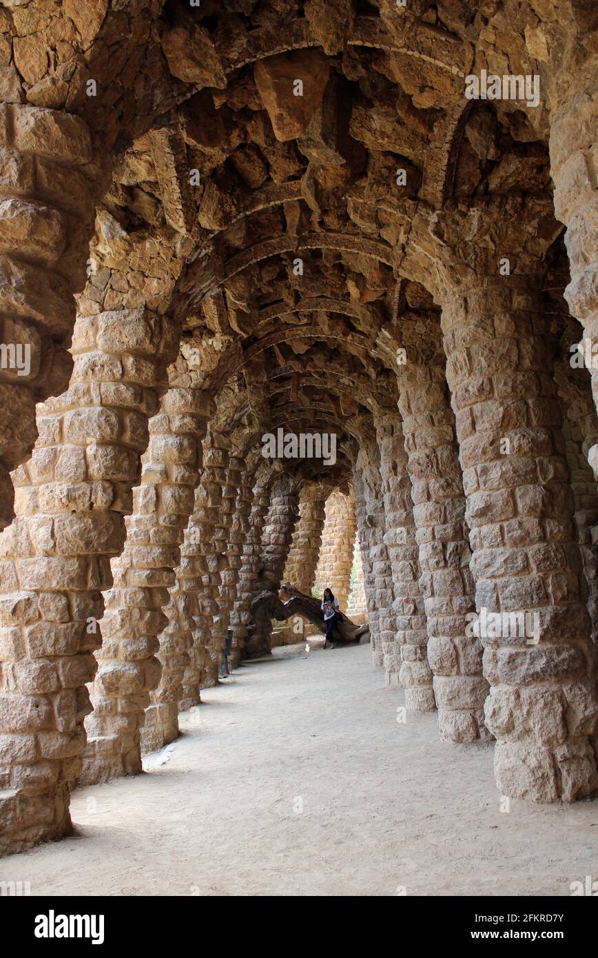 Colonnaded archway of stone designed by Guadi in Park Guell, Barcelona, Spain Stock Photo