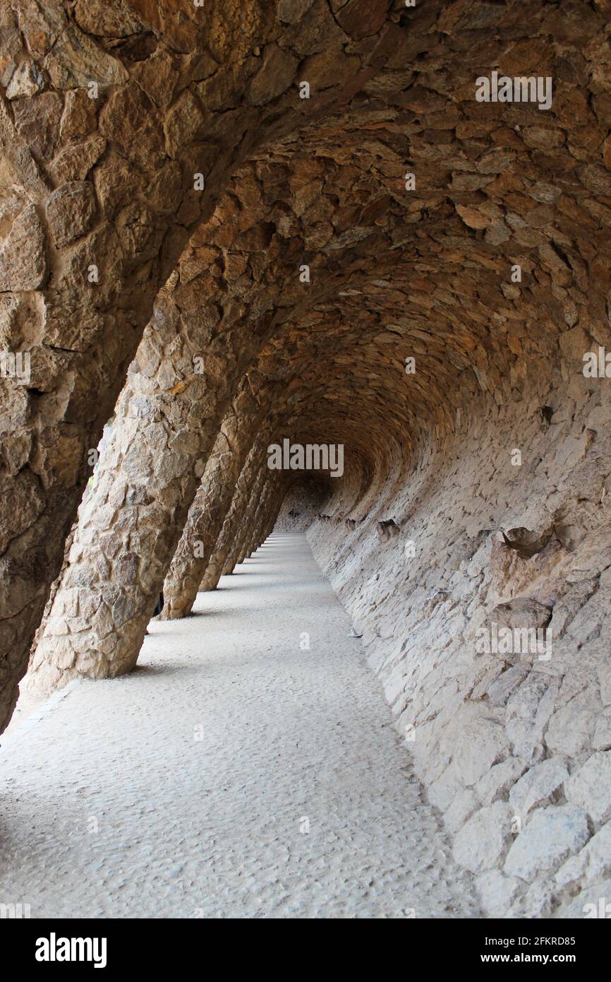 Colonnaded archway of stone designed by Guadi in Park Guell, Barcelona, Spain Stock Photo