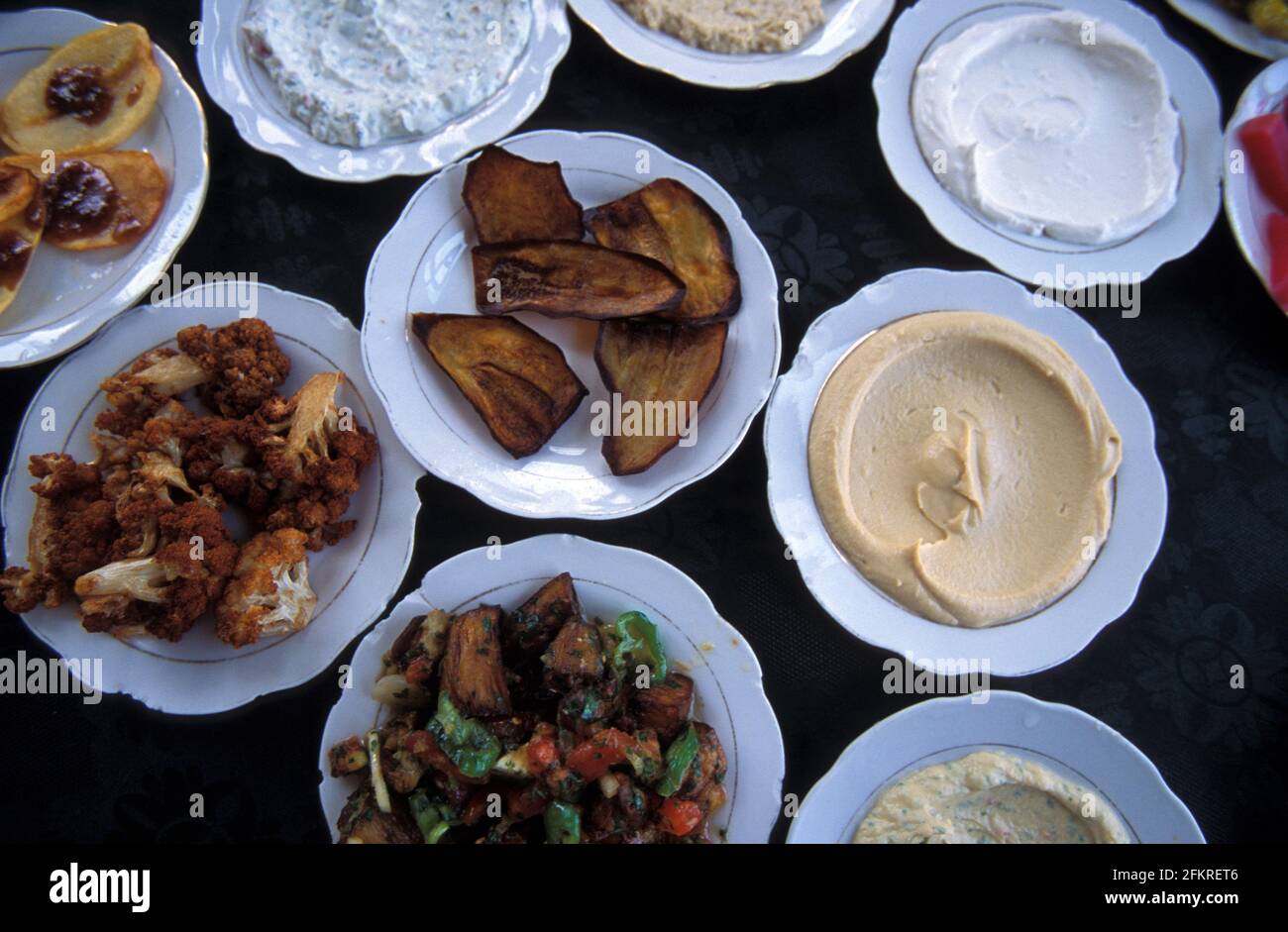 Assorted side order dishes of hummus, aubergines, cauliflower, Syria Stock Photo