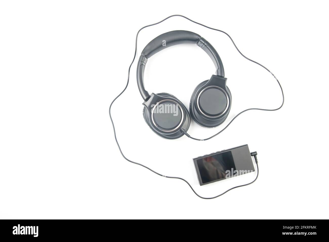 Headphones for listening to music with digital audio player on white