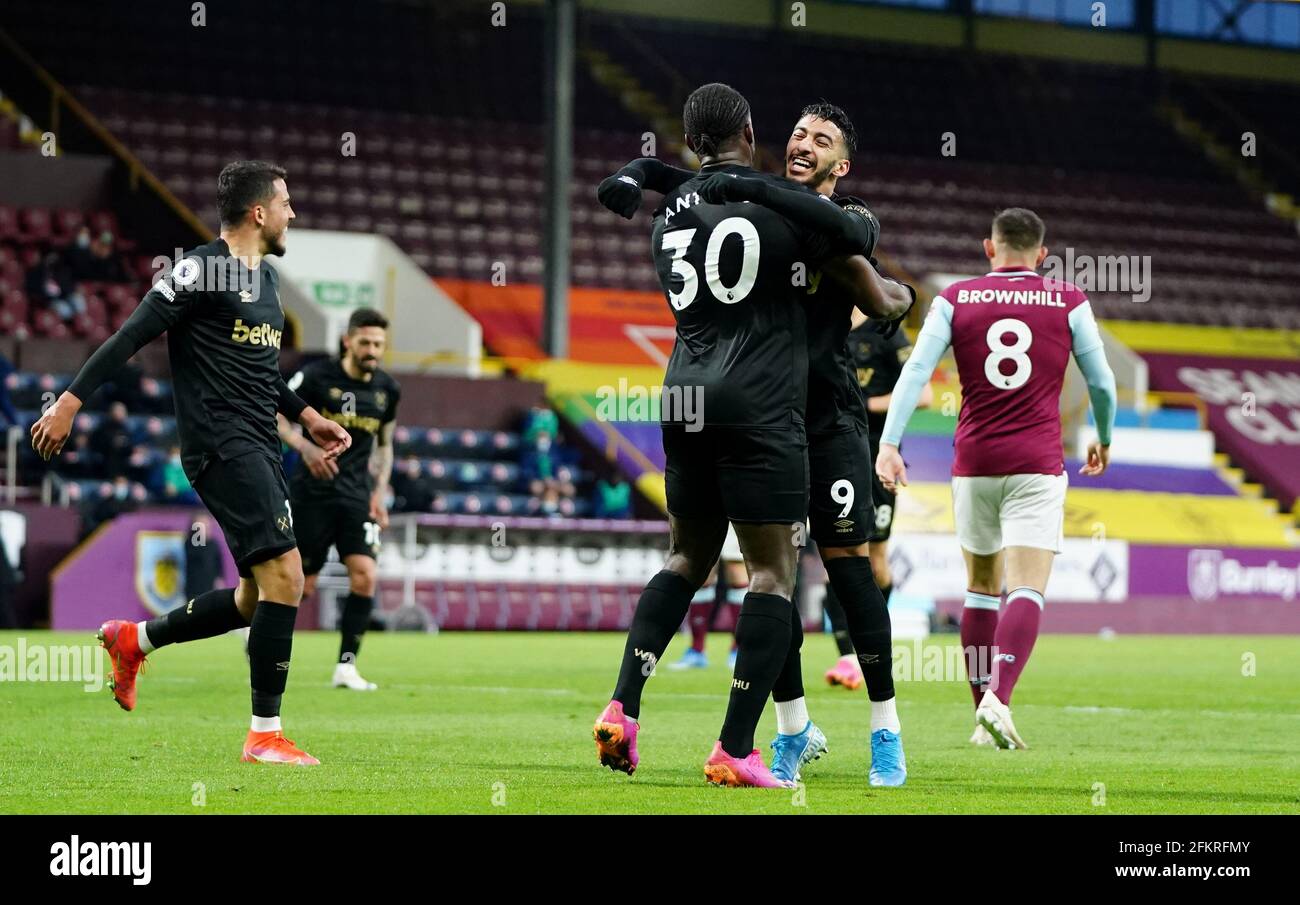 West Ham United's Michail Antonio celebrates scoring their first goal of the game with teammate Said Benrahma (right) during the Premier League match at Tuff Moor, Burnley. Issue date: Monday May 3, 2021. Stock Photo