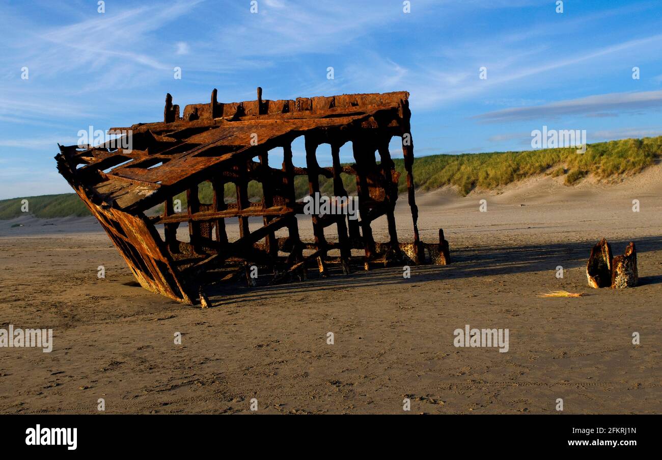 Shipwreck of the Peter Iredale, Fort Stevens State Park, Oregon; Peter Iredale was a steel barque sailing vessel that ran ashore October 25, 1906. Stock Photo
