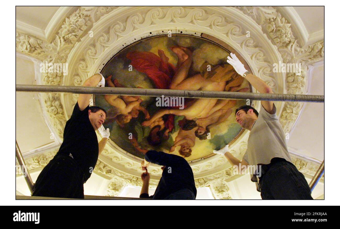 After two years absence the 18th century ceiling painting in the entrance hall of the Royal Academy are being reinstalled. The central work by Benjamin West PRA (1738-1820) after being cleaned and conserved are put back in place.pic David Sandison 5/11/2002 Stock Photo