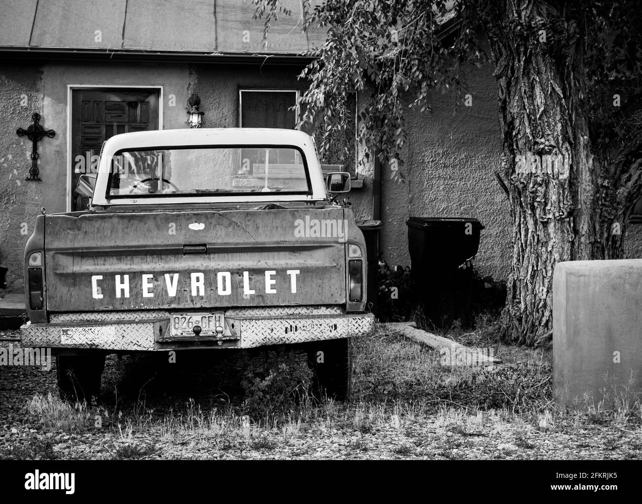 Santa Fe, New Mexico, USA, house, home, residence with old Chevrolet pick-up truck in front yard. Stock Photo