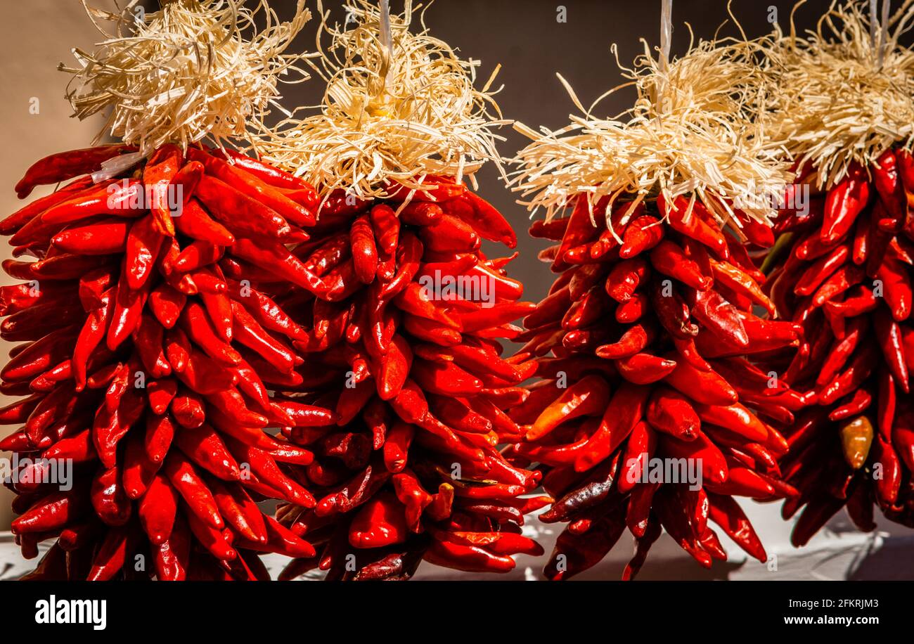 New Mexico red chile ristras, pequin chile ristra in Santa Fe, NM. Stock Photo