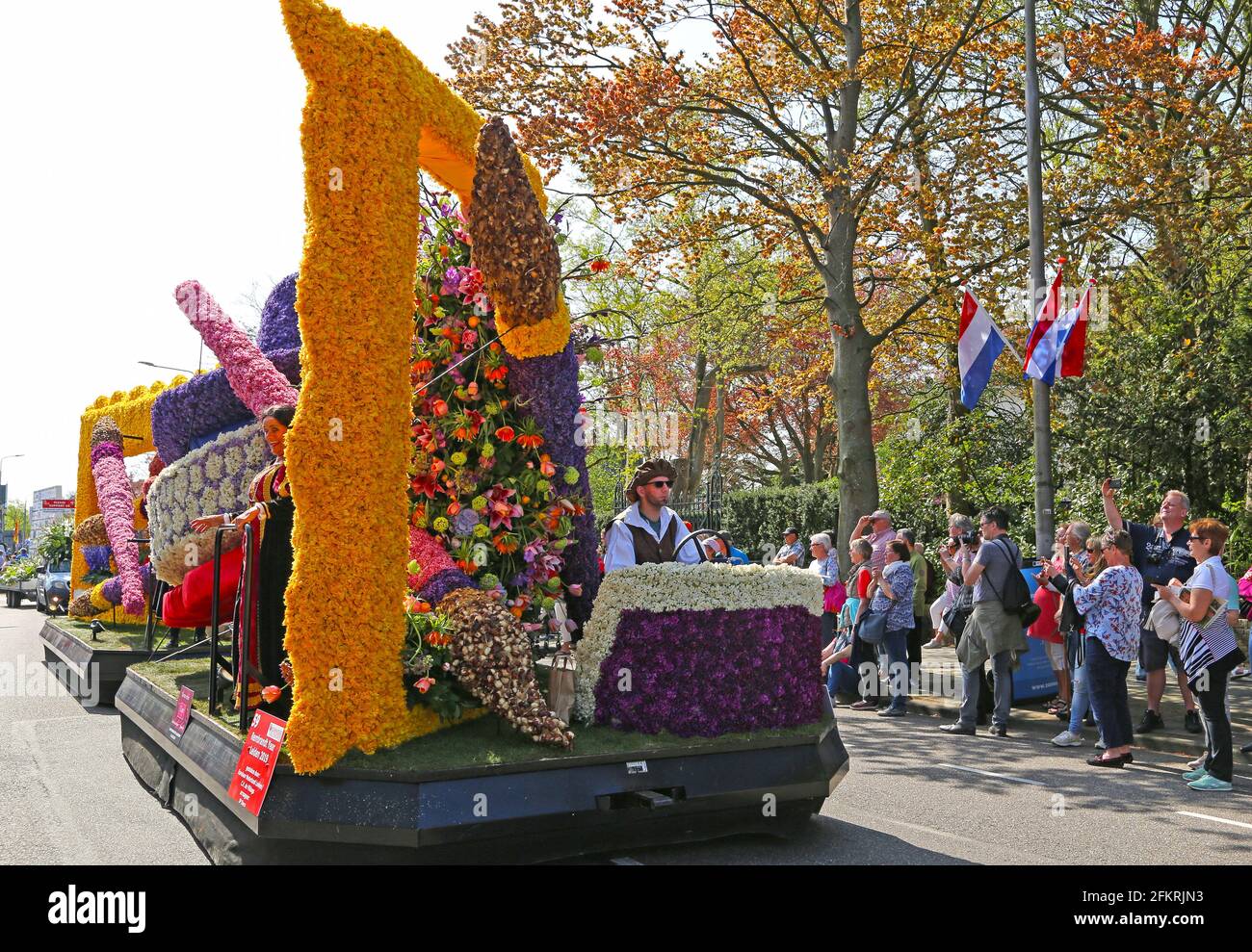Sassenheim, Netherlands – April 21, 2018: 100 years Bloemencorso Bollenstreek Flower Parade traditional folk holiday Stock Photo