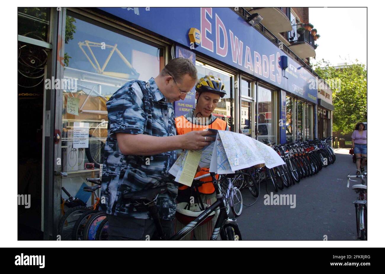 Cole Morton with cycle instructor Steve Wagland (check spelling please) ride in from Edwardes bycicle shop in Camberwell road  through Elephant & Castle over Waterloo Bridge into Soho.Pic David Sandison 13/6/2003 Stock Photo