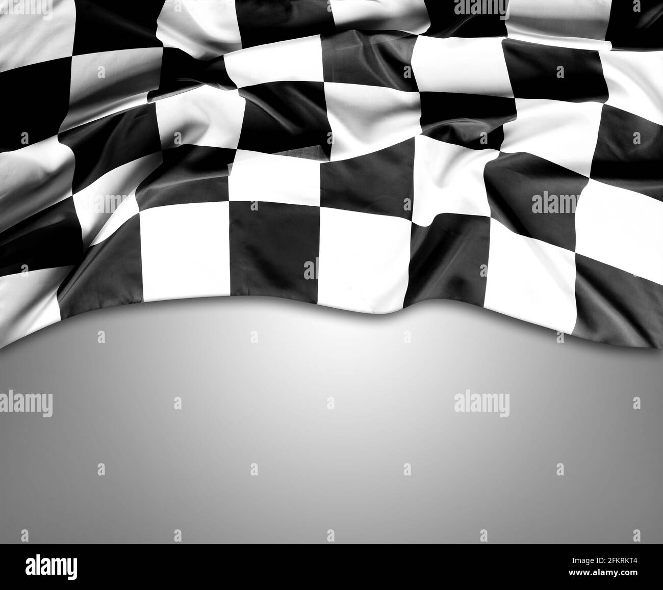 Checkered black and white flag on grey background. Copy space Stock