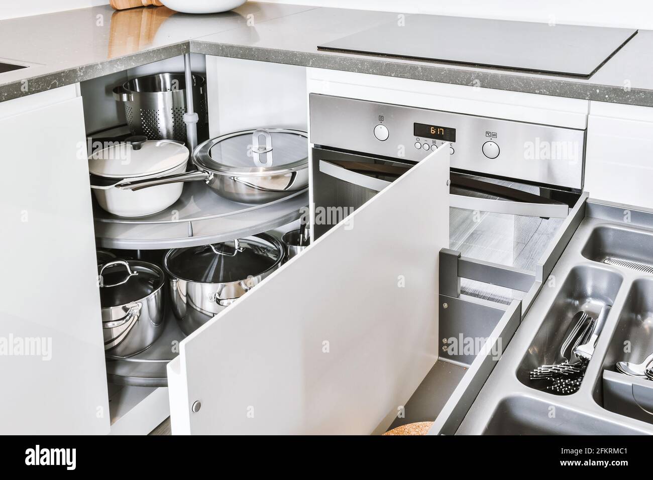 Kitchenware storage drawers in kitchen Stock Photo