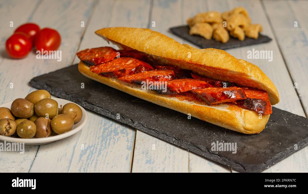 chorizo sandwich and olive tapa Stock Photo - Alamy