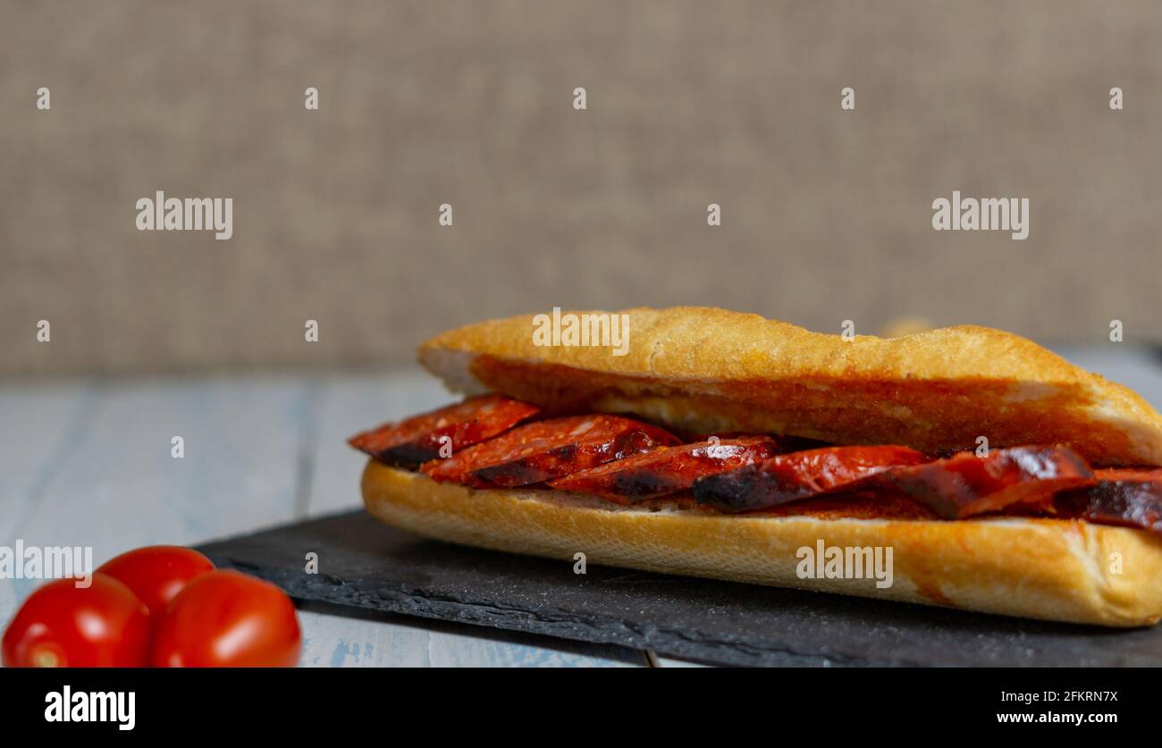 chorizo sandwich and olive tapa Stock Photo - Alamy