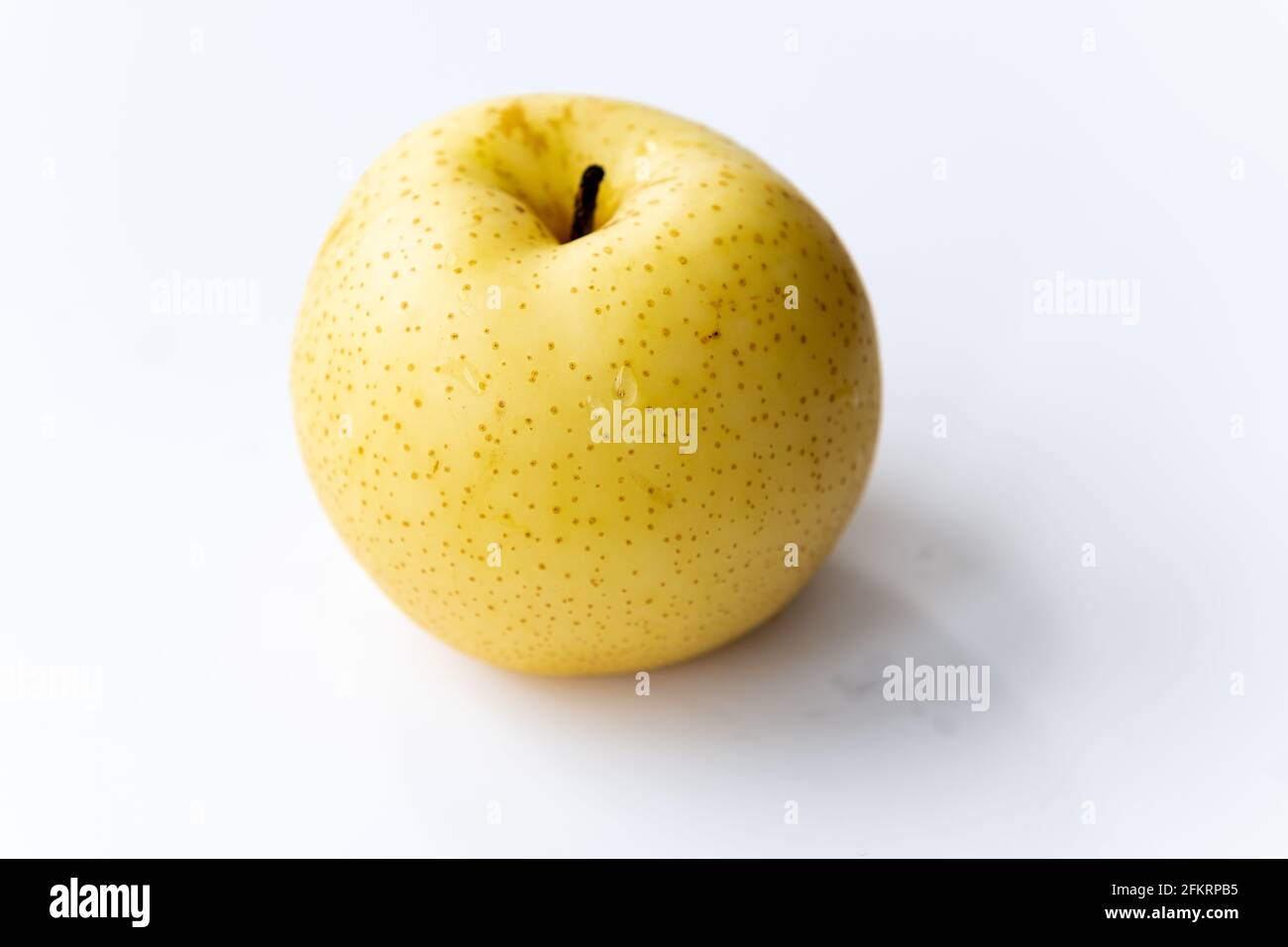 A Korean pear isolated on a white background. Stock Photo