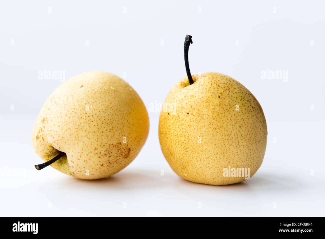 Two Asian pears isolated on a white. Stock Photo