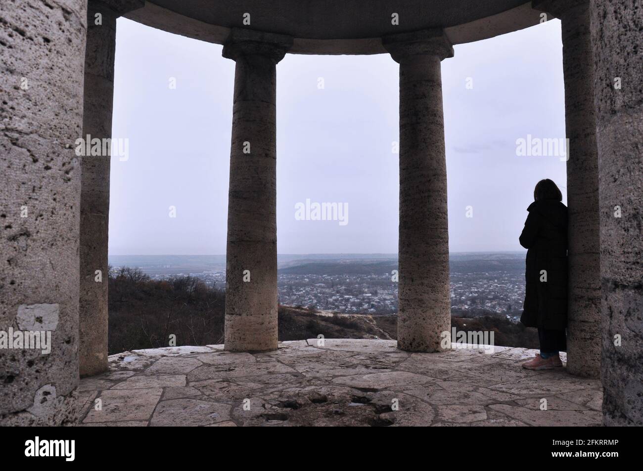 Pyatigorsk, Russia - March 23, 2021: young woman looking at the city from the Aeolova harp pergola, Caucasus Mineral waters, Russia. Stock Photo