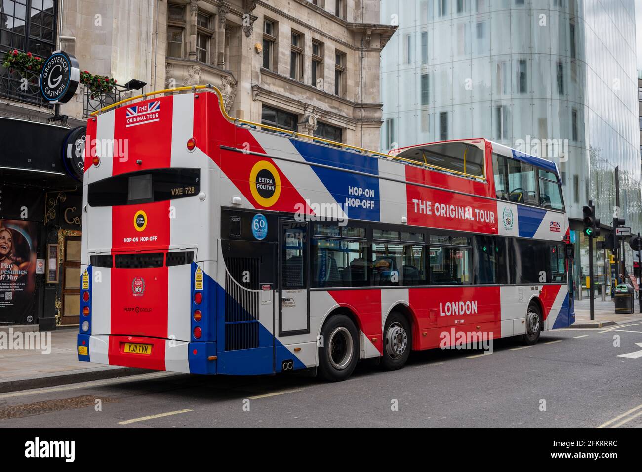 A empty double decker tourist bus by the Swiss Centre waiting for customers for a tour of London's sights. Stock Photo