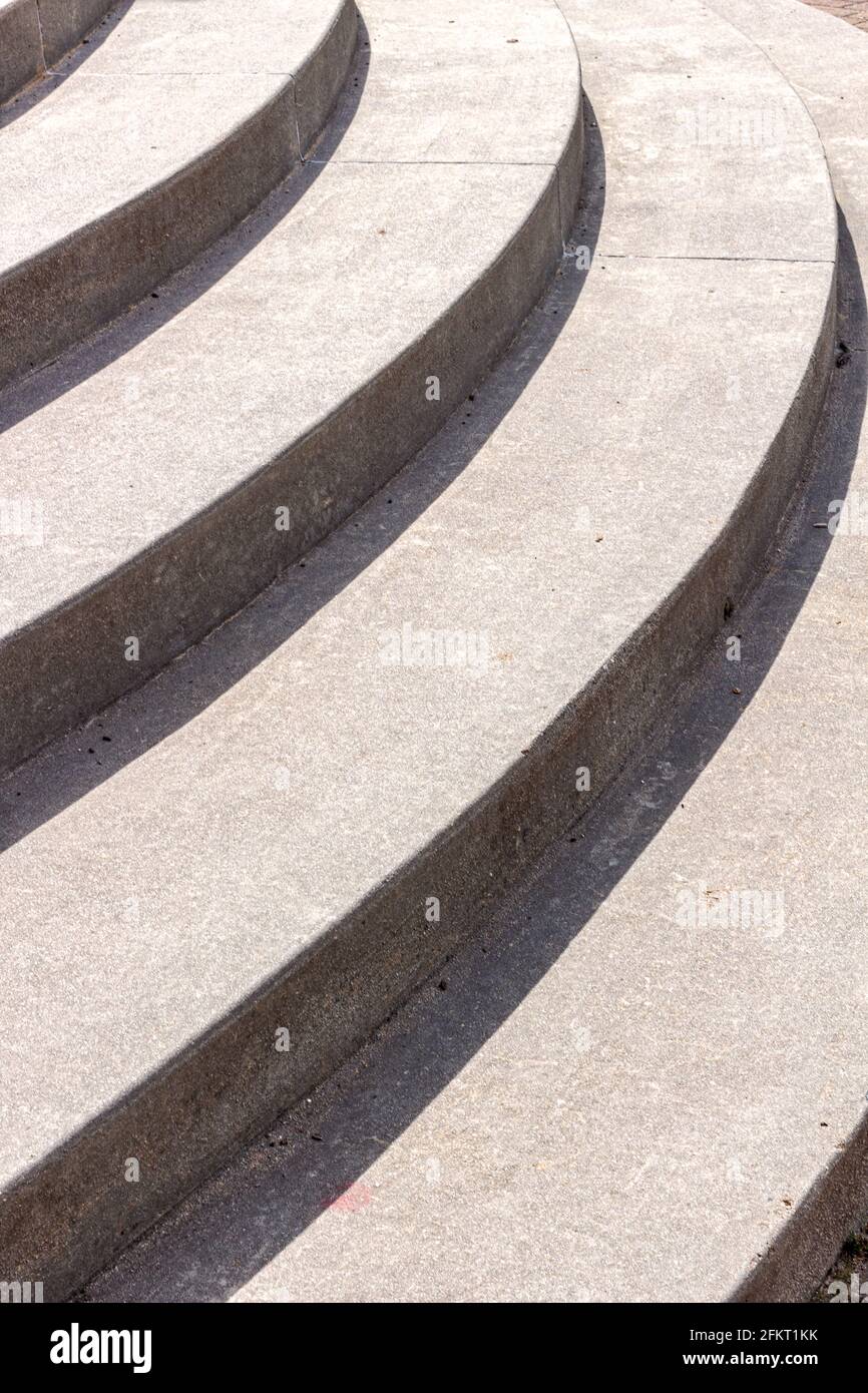 Curving concrete steps create an abstract design of gracefully curving lines. Stock Photo