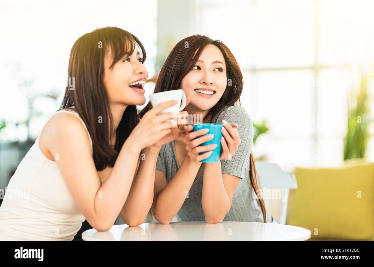 Happy Young woman talking   at coffee shop Stock Photo