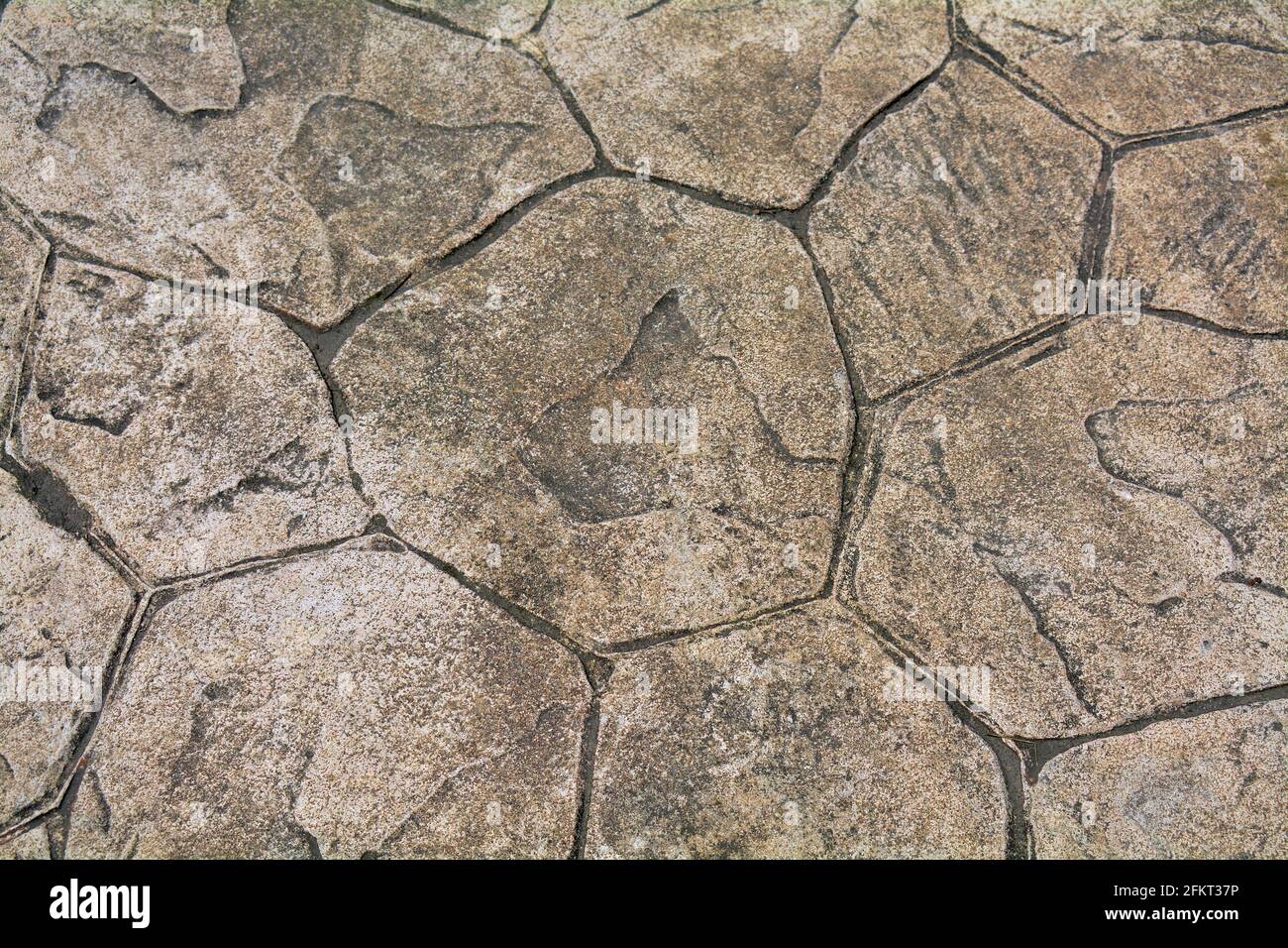 Cracked and random design paving suitable for backgrounds Stock Photo