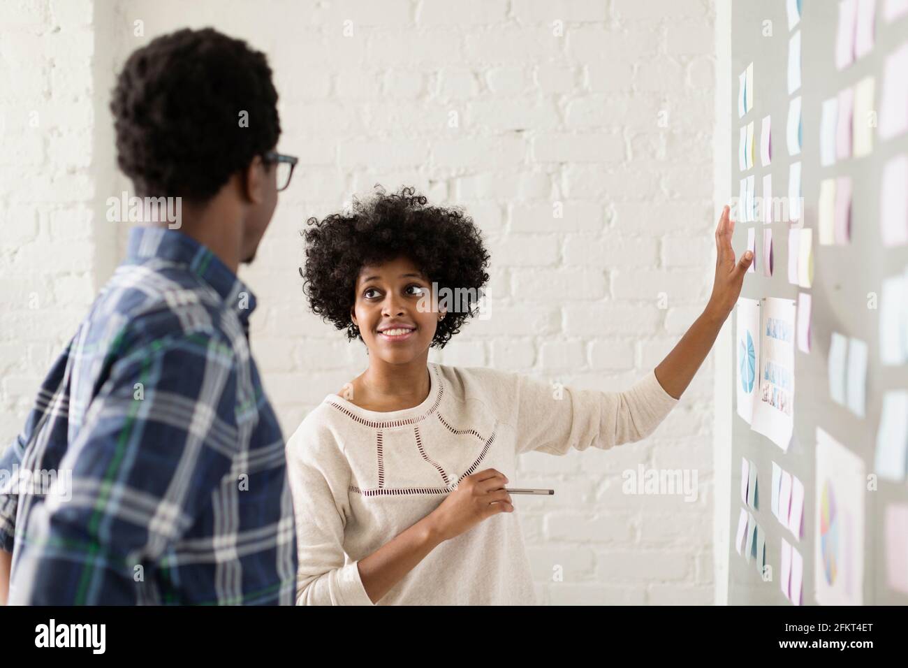 Two colleagues working in creative studio Stock Photo