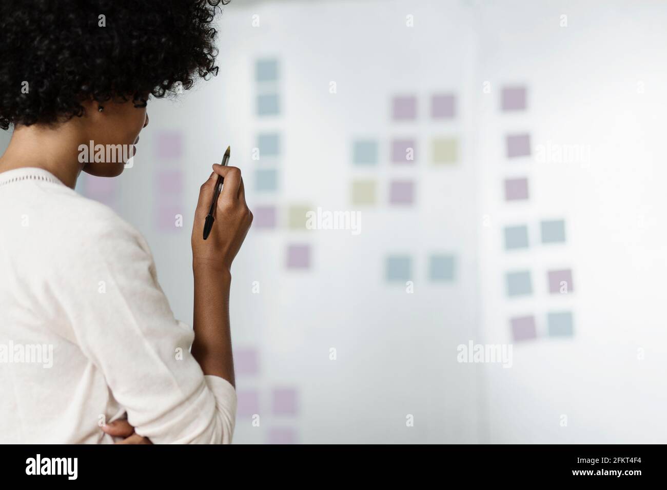 Young woman with pen hi-res stock photography and images - Alamy