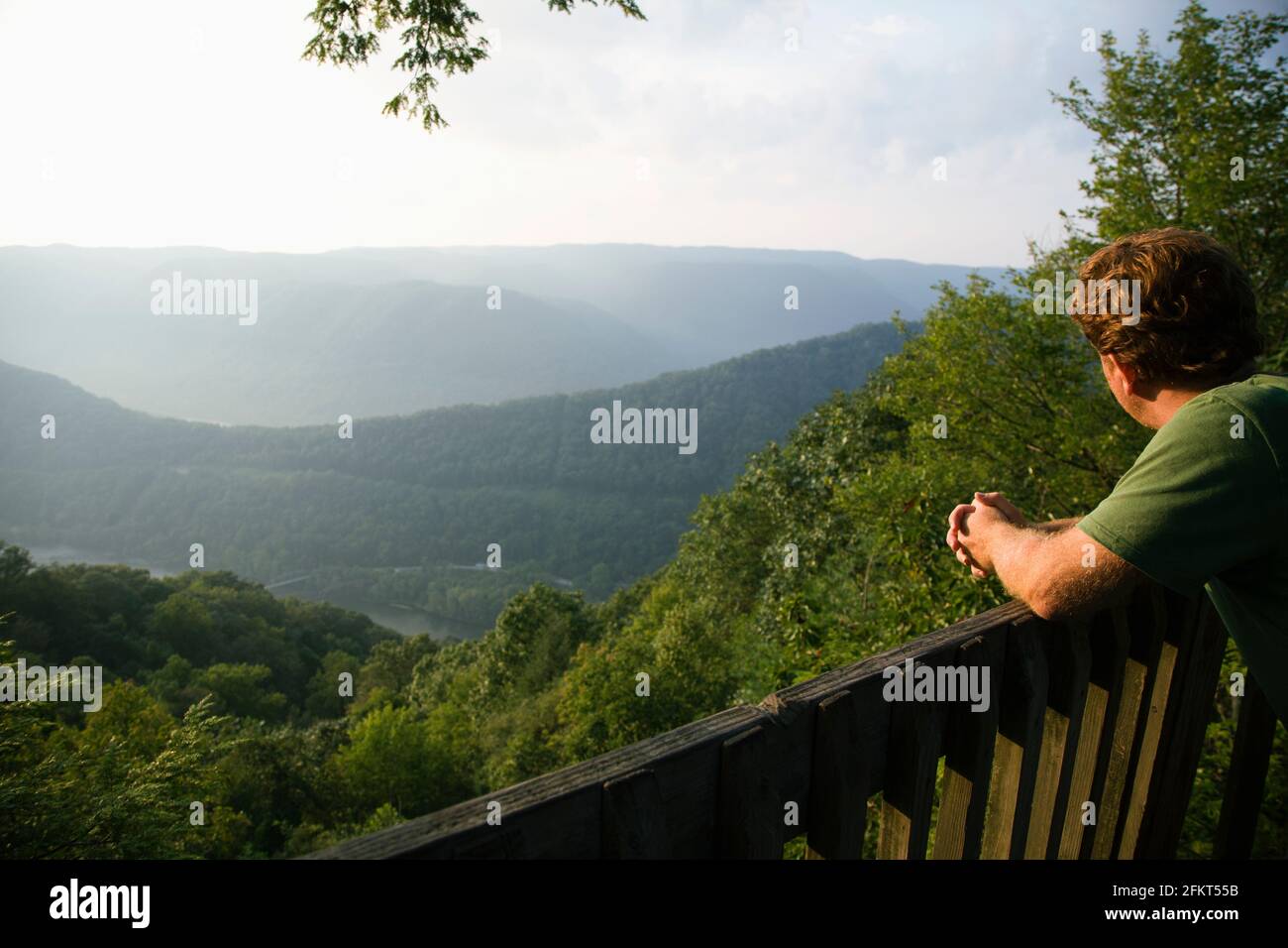 Mid adult man looking at view from viewing platform, rear view, New River Gorge National River, Fayetteville, West Virginia, USA Stock Photo
