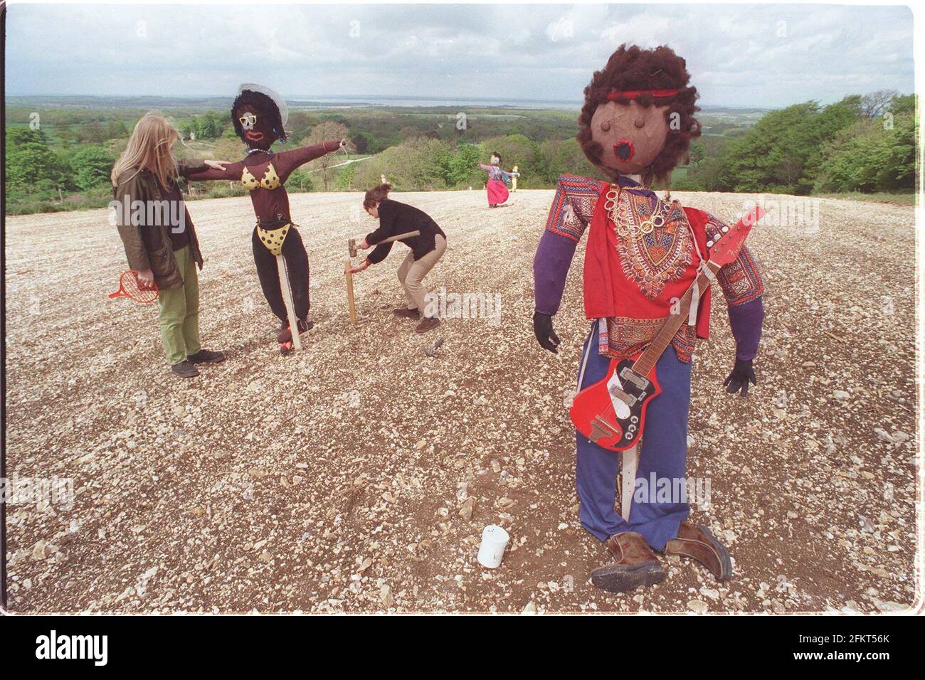 Jimi Hendrix among the figures chosen by teachers on the Isle of Wight when asked to make scarecrows in an Arts Council project to raise pupils rural awareness. Project staff Becky Priest and Rachel Nightingale are putting the finishing touches to the project Stock Photo