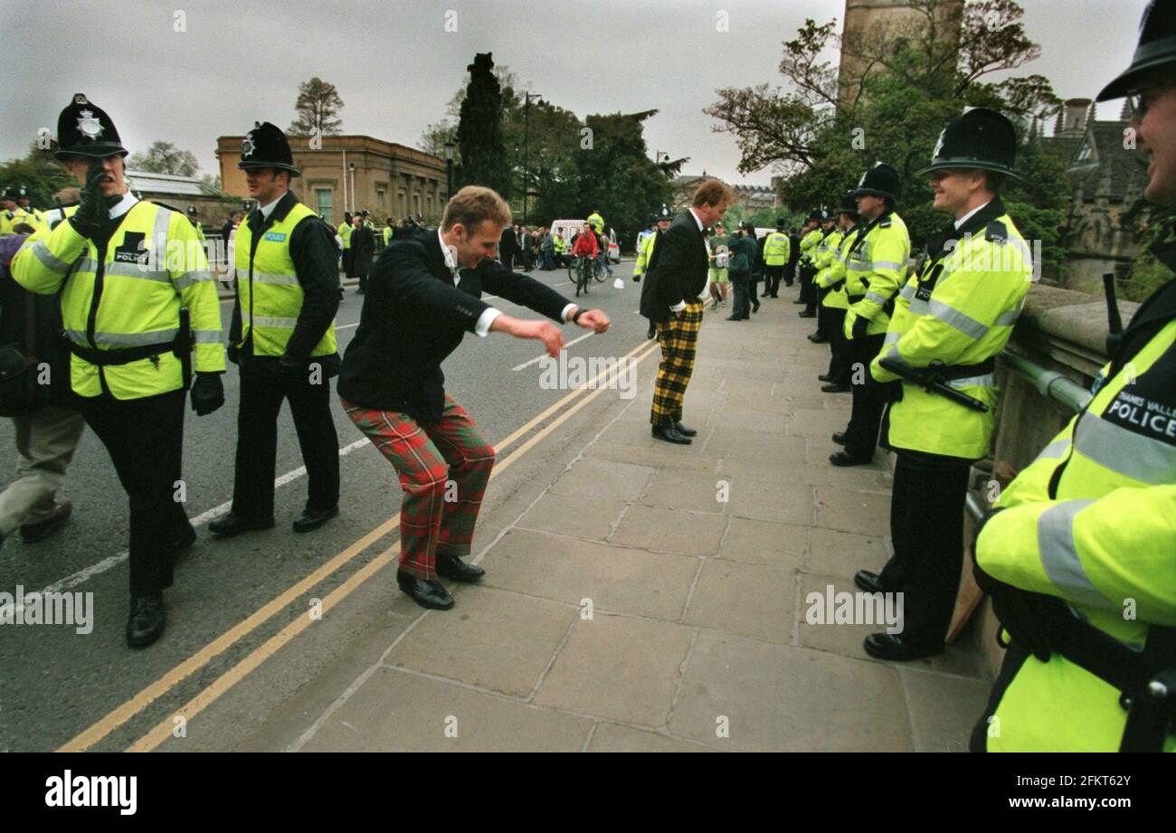 Oxford University May Day Celebrations May 1998 Police concerned about the strong currents in the river Cherwell guard the Magdalen bridge in Oxford to stop students from jumping from the bridge as part of their May Day celebrations Stock Photo