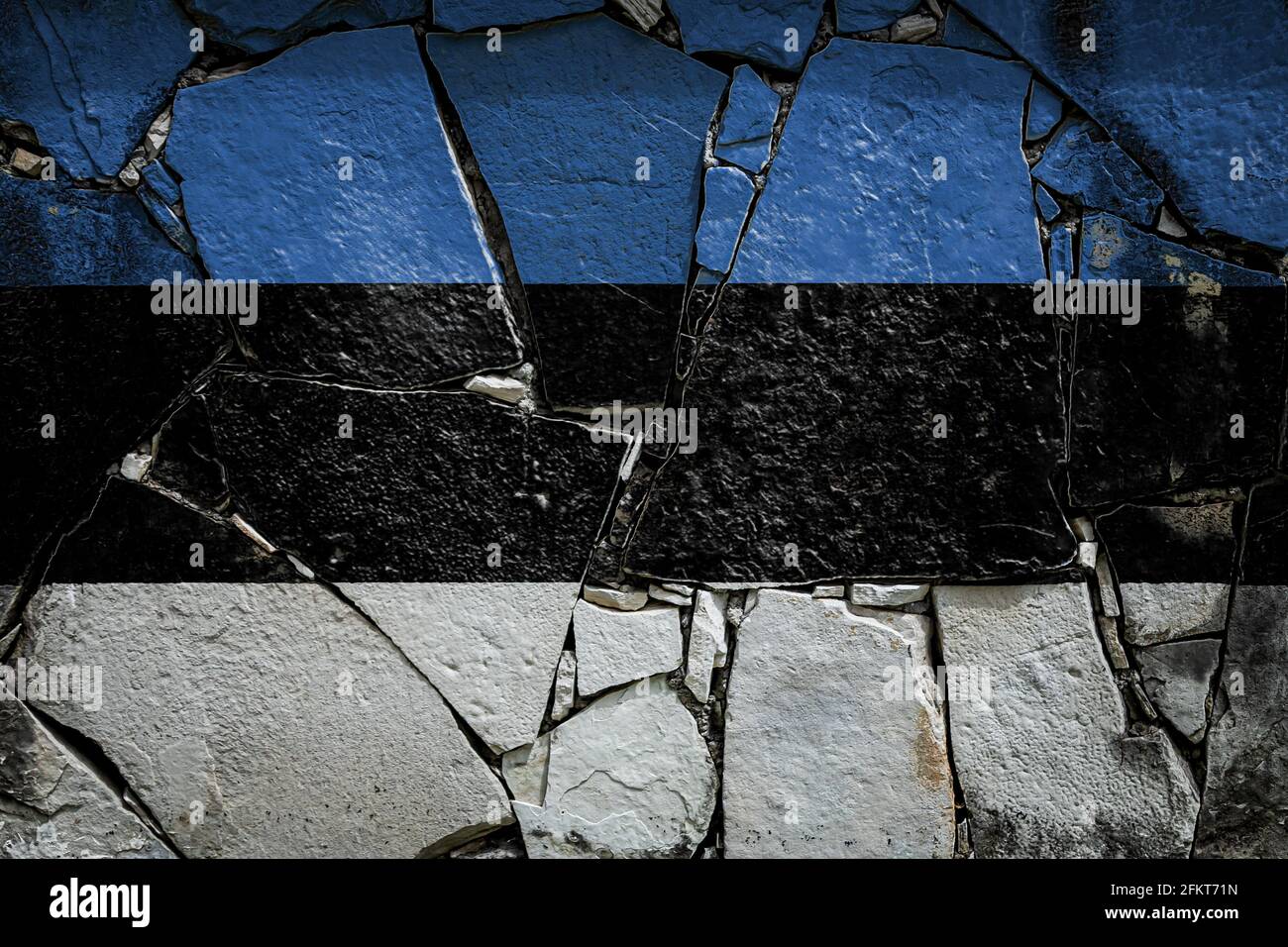 National flag of Estonia depicting in paint colors on an old stone wall ...