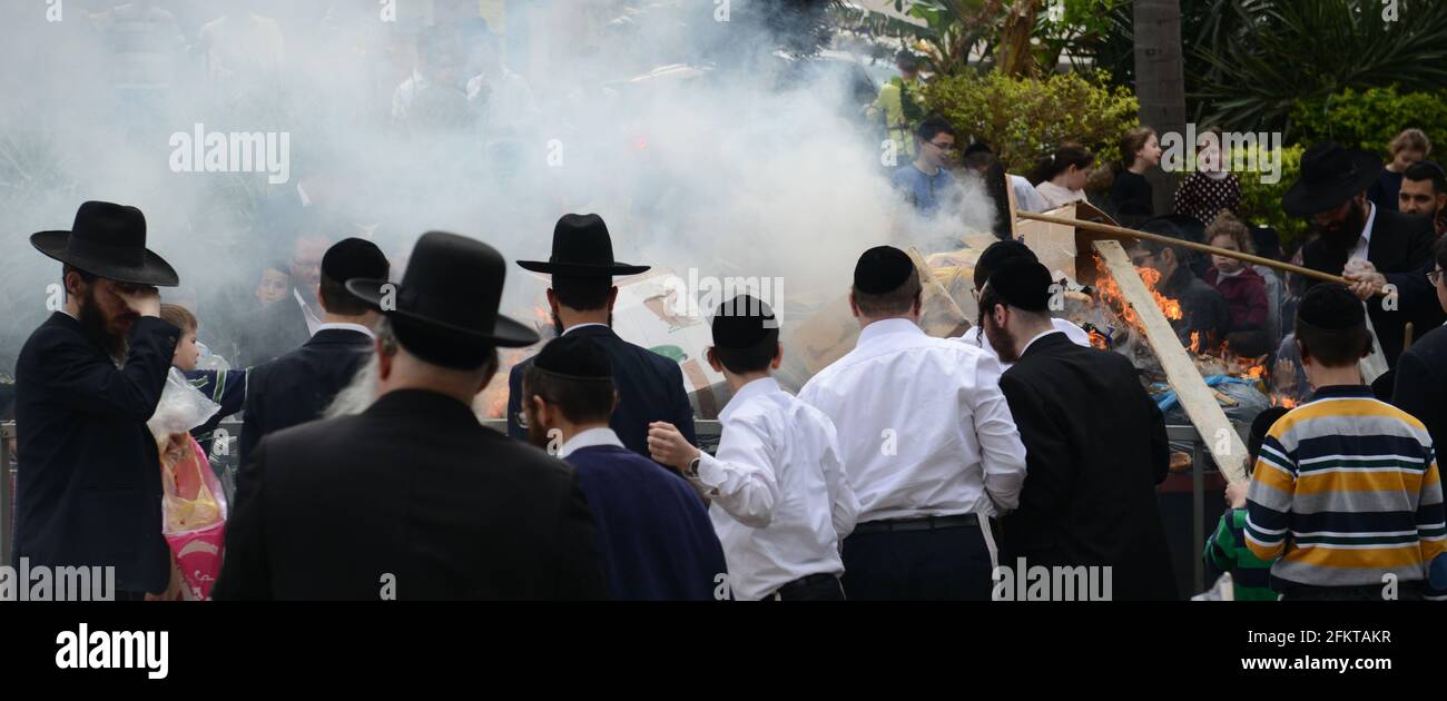 Orthodox Jews burning bread and Chametz as part of the preparations for the Passover Holiday in Bnei Brak, Israel. Stock Photo